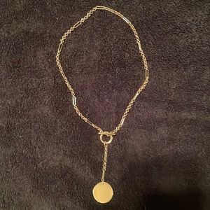 Gold colour necklace with plain medallion